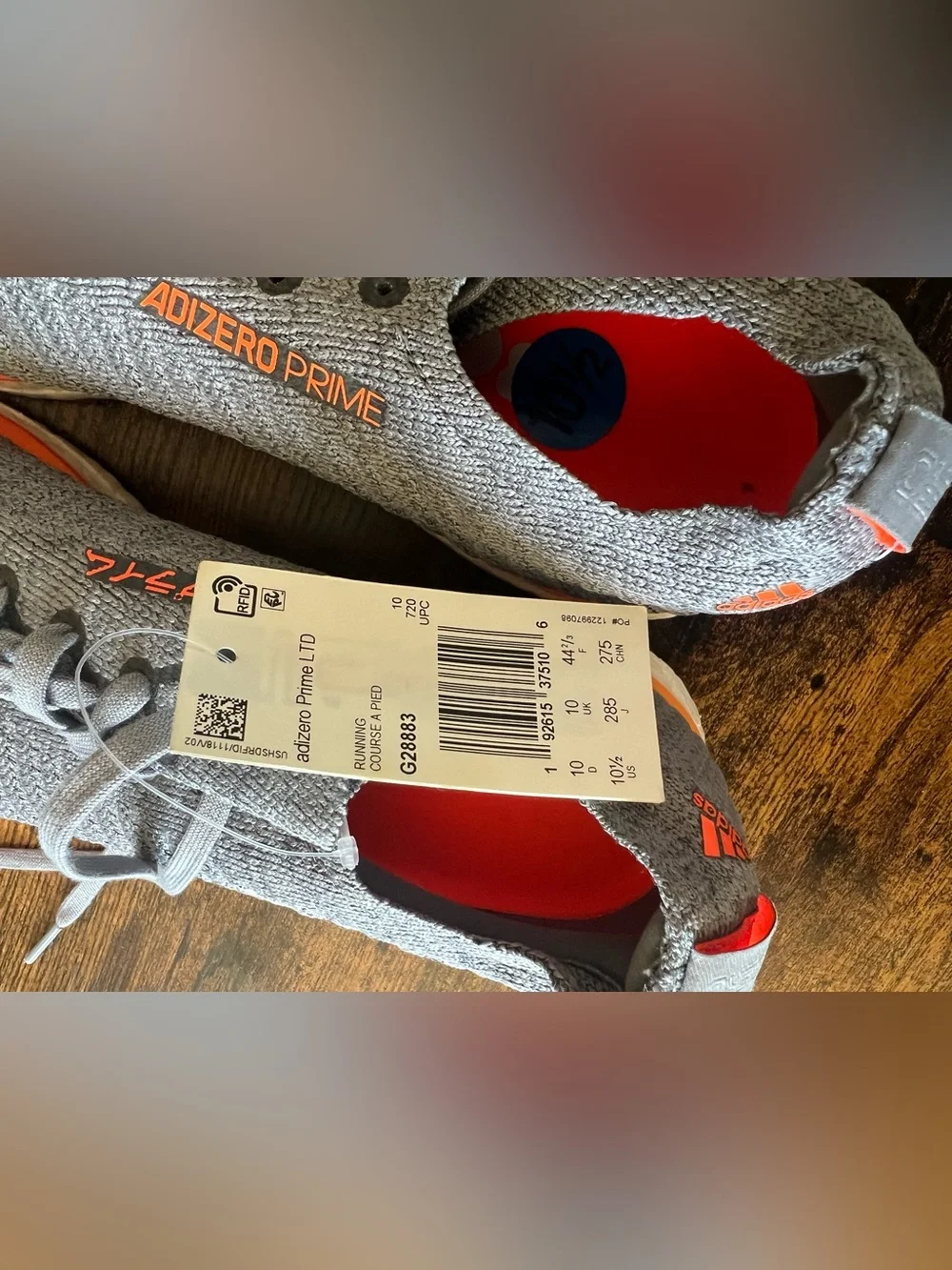 adidas Adizero Prime Light Gray Running Shoes with Orange Accents
